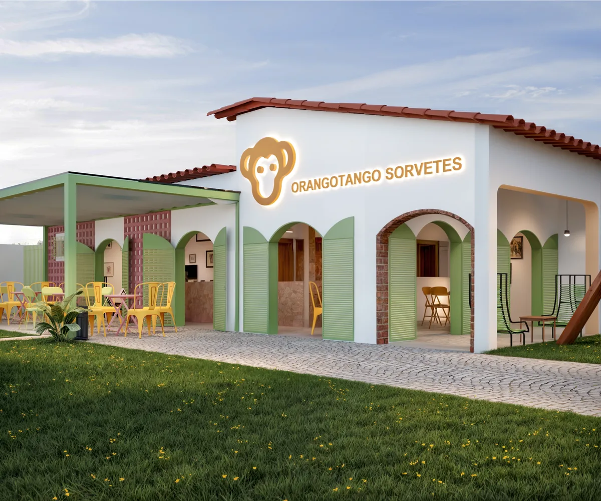 Orangotango Goianésia — Fachada em arcos com gramado e playground